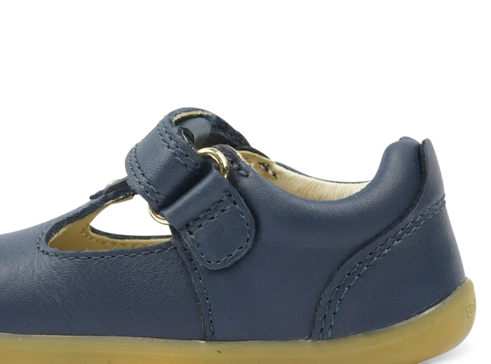 A unisex first shoe by Bobux, style Louise, a velcro T-bar in navy. Inner side view.