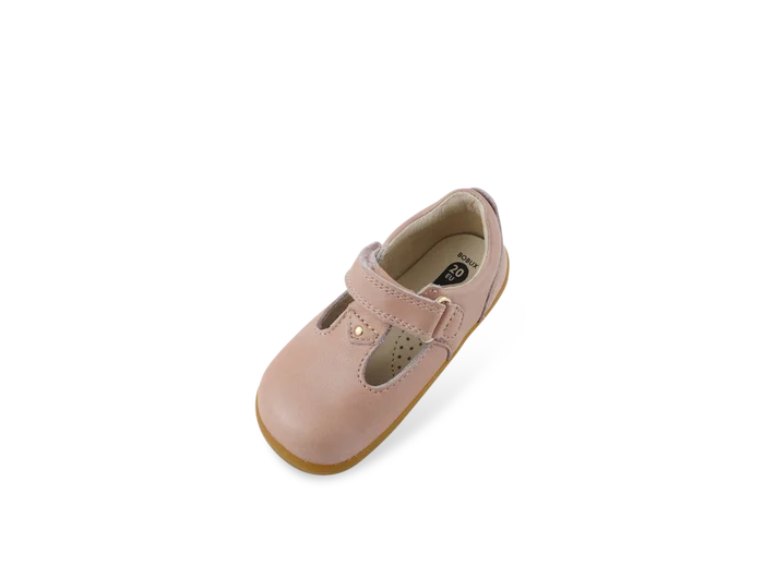 A girls first shoe by Bobux, style Louise, a velcro T-bar in dusky pink pearl. Above view.