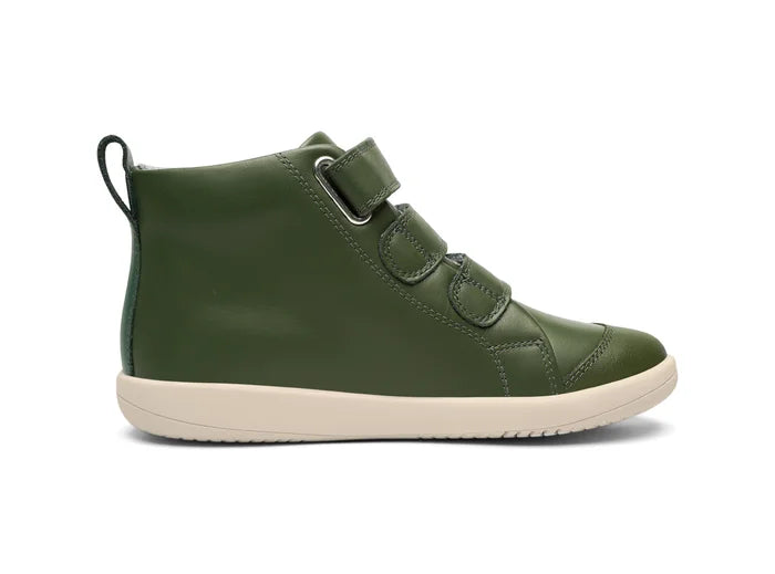A boys casual boot by Bobux, style Hi-Court in forest green leather with three velcro straps on a white sole. Inner side view.