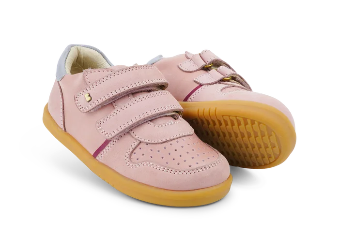 A girls casual full shoe by Bobux, style Riley, double velcro in dusky pink leather and suede. Angled view of a pair one showing gum sole.
