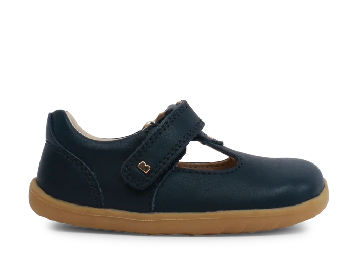 A unisex first shoe by Bobux, style Louise, a velcro T-bar in navy . Side view.
