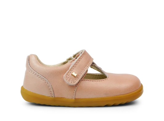 A girls first shoe by Bobux, style Louise, a velcro T-bar in dusky pink pearl. Right side view.