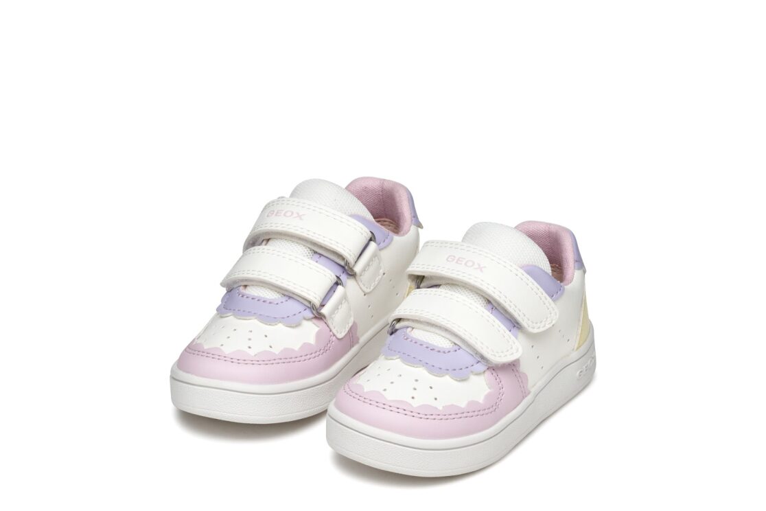 A girls casual shoe by Geox, style B Eclyper in white/ Lt yellow, with double velcro fastening. Angled view of a pair.