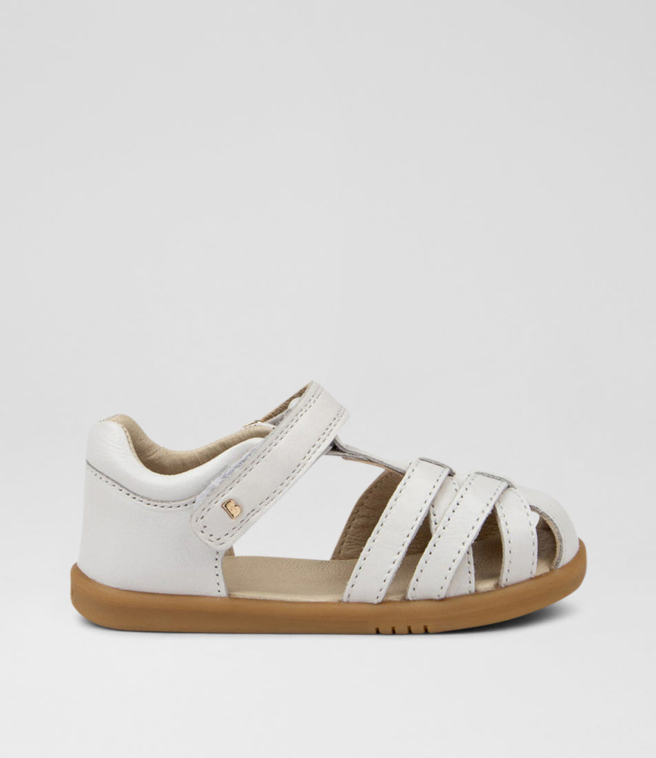 A unisex sandal by Bobux, style Cross Jump in white with velcro strap and light brown sole. Right side view