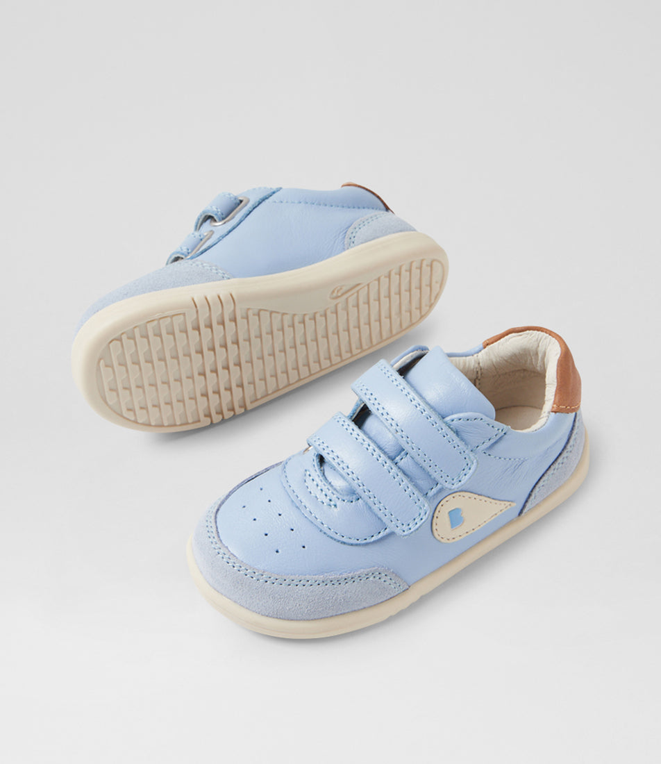 A unisex casual shoe by Bobux, style Champ (I-Walk) in Skyway with two velcro stras, brown back ankle detail amd white sole. View of pair with one sole showing