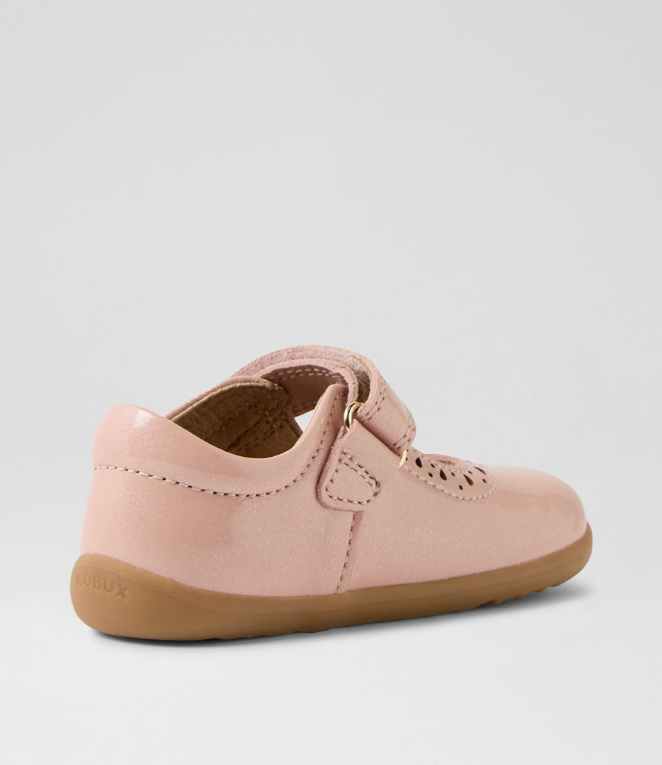A girls casual shoe by Bobux, style Lola (I-Walk) in Cameo Rose with velcro strap, cut out pattern detail and light brown sole. Angled left inner view