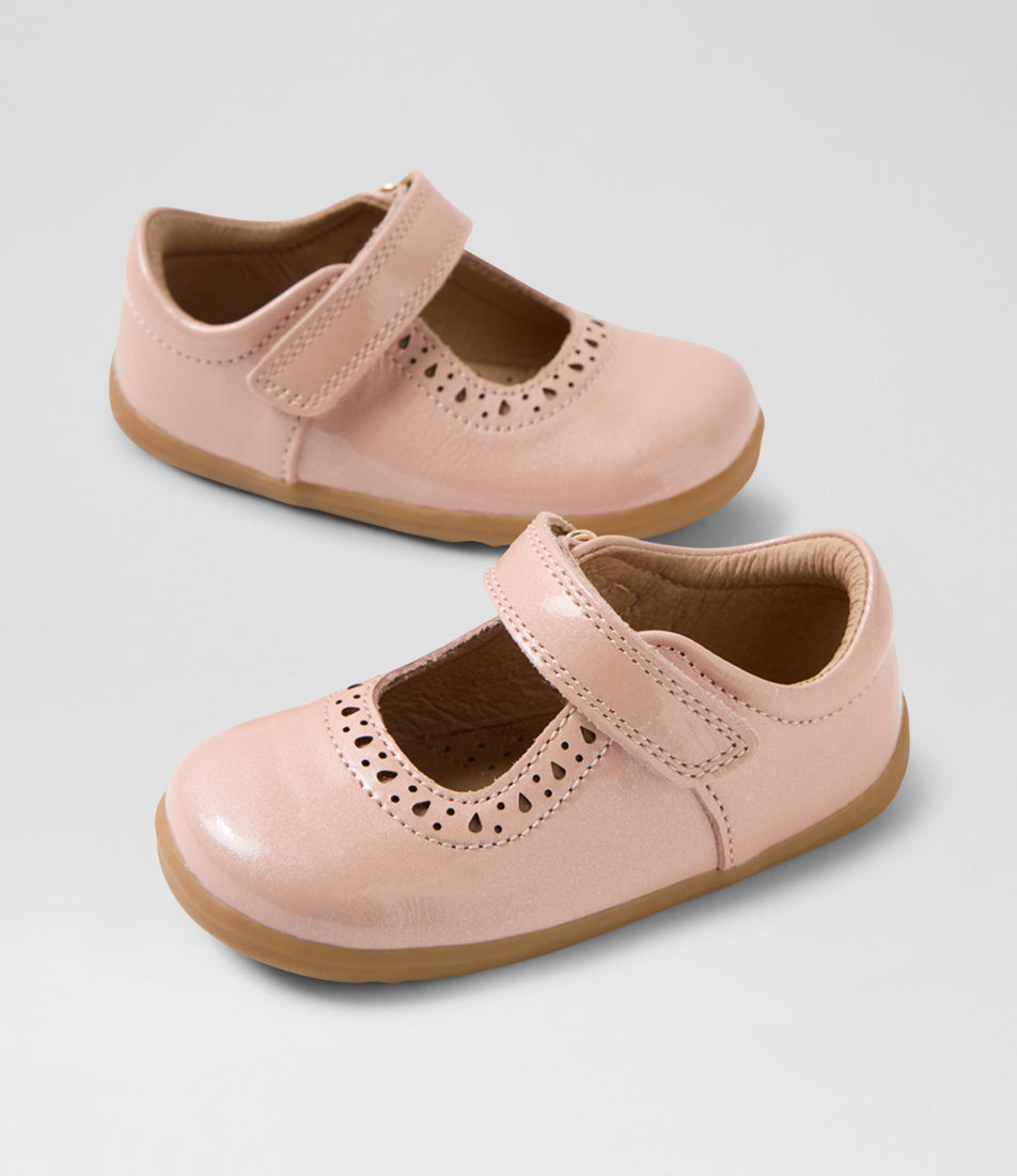 A girls casual shoe by Bobux, style Lola (I-Walk) in Cameo Rose with velcro strap, cut out pattern detail and light brown sole. View of pair