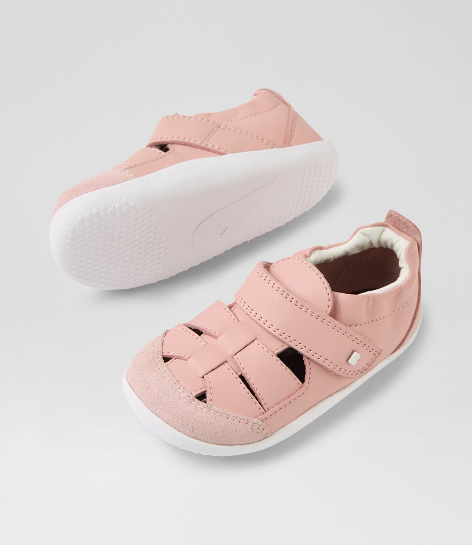 A girls pre-walker shoe, style Maris in pink. Sandal style with velcro strap and elasticated ankle. View of pair with white sole 