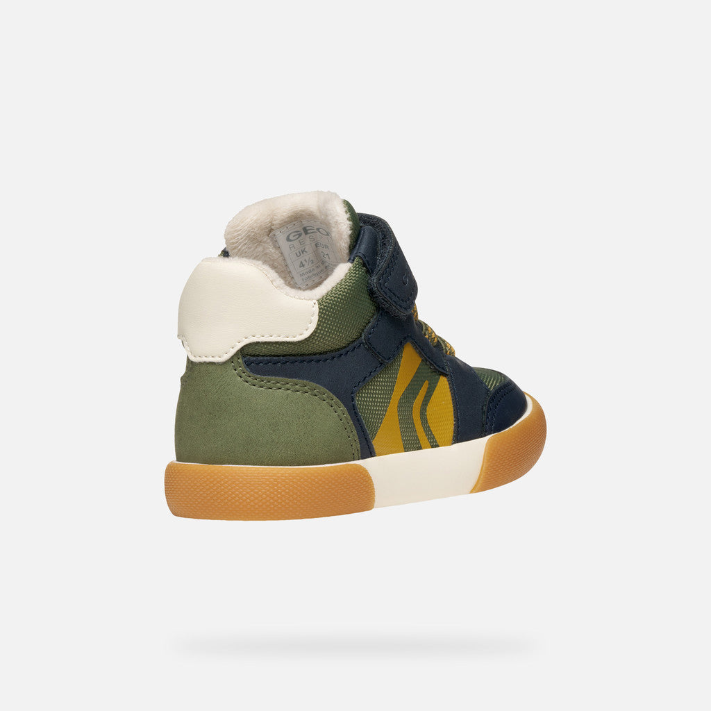 A boys ankle boot by Geox, style Gisli Boy A, in military/navy with velcro strap and green/yellow laces. Angled outer back view