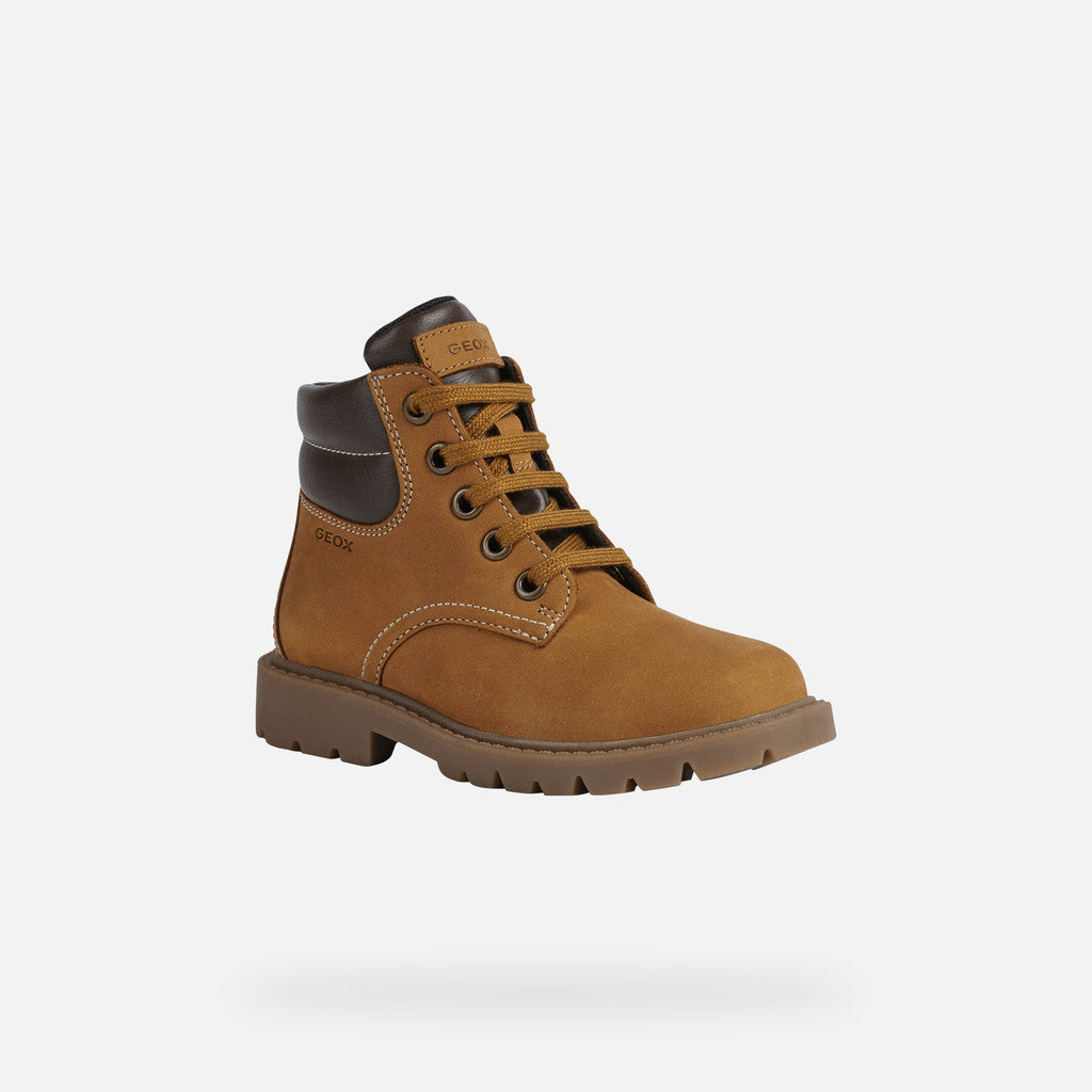 A boys lace up ankle boot by Geox, style Shaylax Boy, in yellow/brown. Angled side view