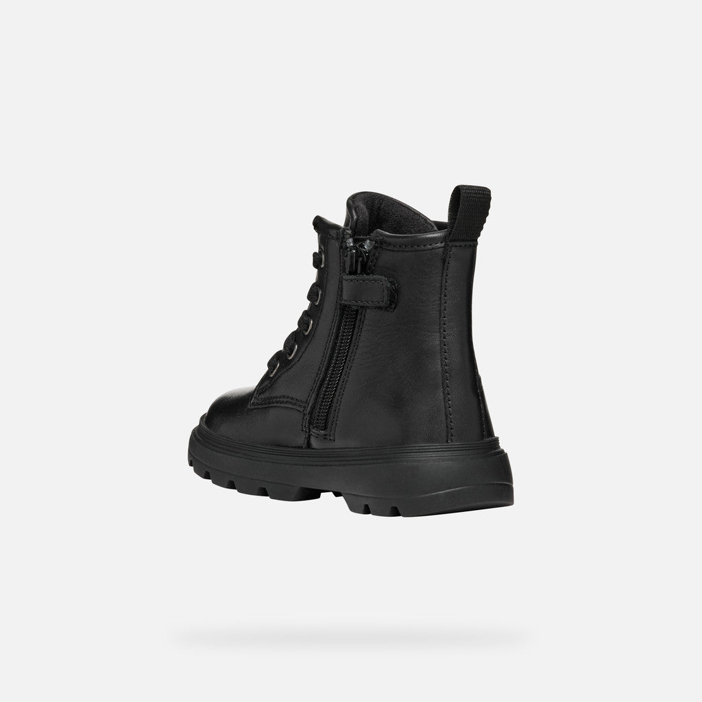 A girls chunky boot by Geox, style B465YA Kiddartah, in black with silver glitter star detail. Zip and lace fastening. Angled left arm de view showing zip fastening.