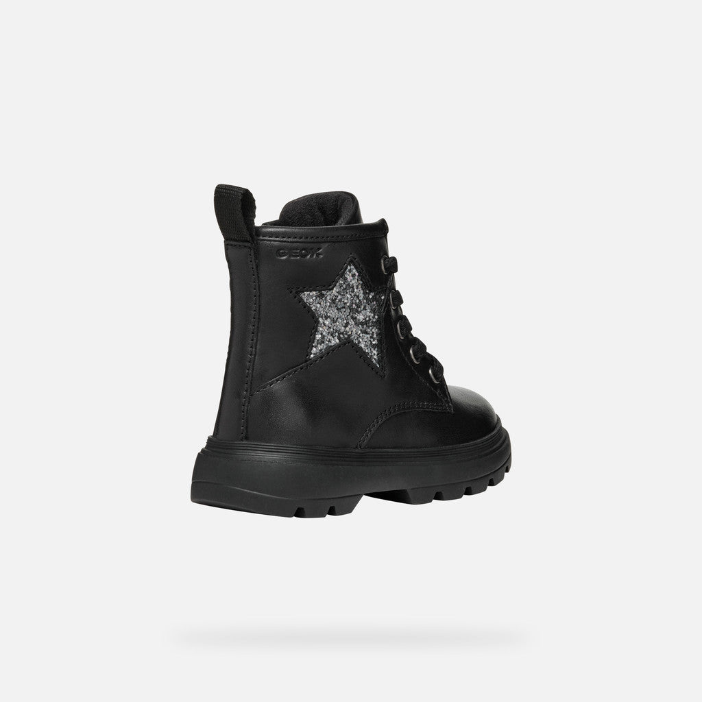 A girls chunky boot by Geox, style B465YA Kiddartah, in black with silver glitter star detail. Zip and lace fastening. Angled right side view.