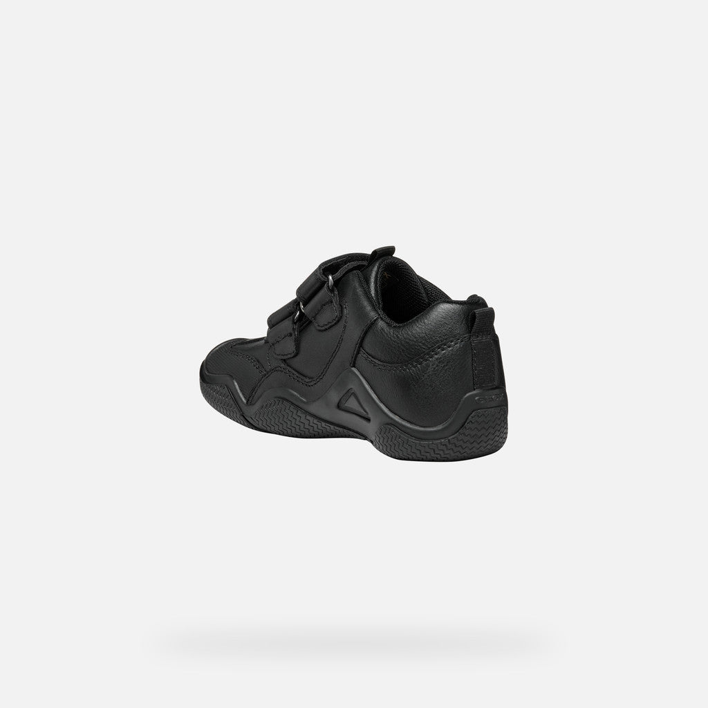 A boys school shoe by Geox, style Wader in black leather with two velcro straps and toe and heel bumpers. Angled back view