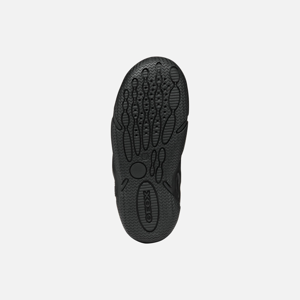 A boys school shoe by Geox, style Wader in black leather with two velcro straps and toe and heel bumpers. View of sole