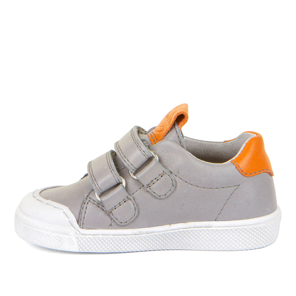 A boys casual shoe by Froddo, style Rosario G2130316-15, in grey leather with orange trim and toe bumper. Velcro fastening. Left side view.