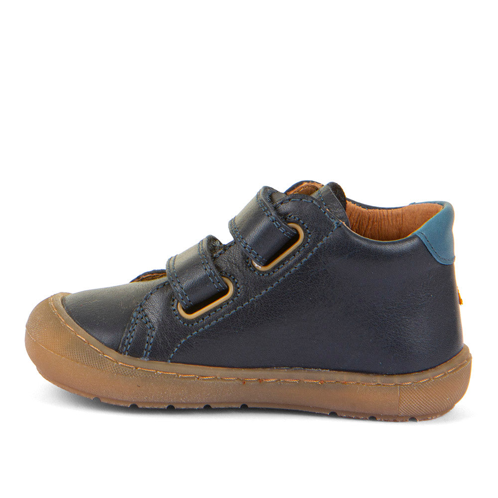 A casual boys shoe by Froddo, style Ollie S Star, in navy blue with yellow star on side, with two velcro straps and heel and toe bumpers. Inner side view