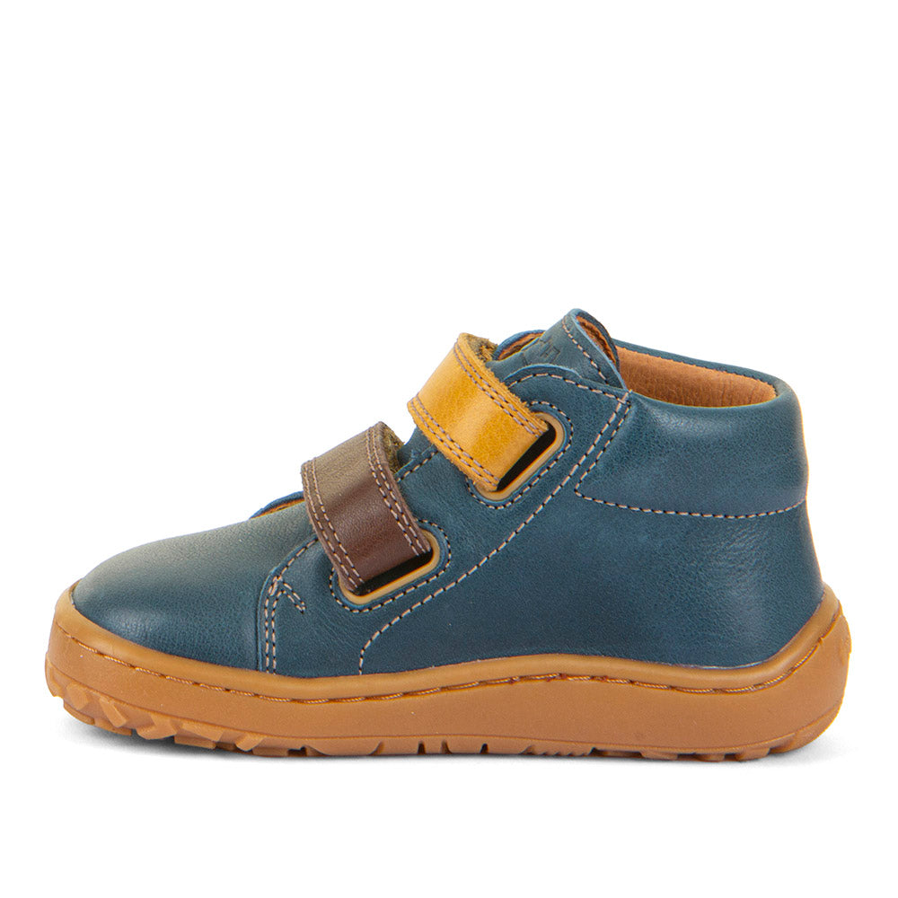 Froddo First Step Barefoot shoe in dark denim with heel and toe bumpers and two yellow and brown velcro straps. Inner side view