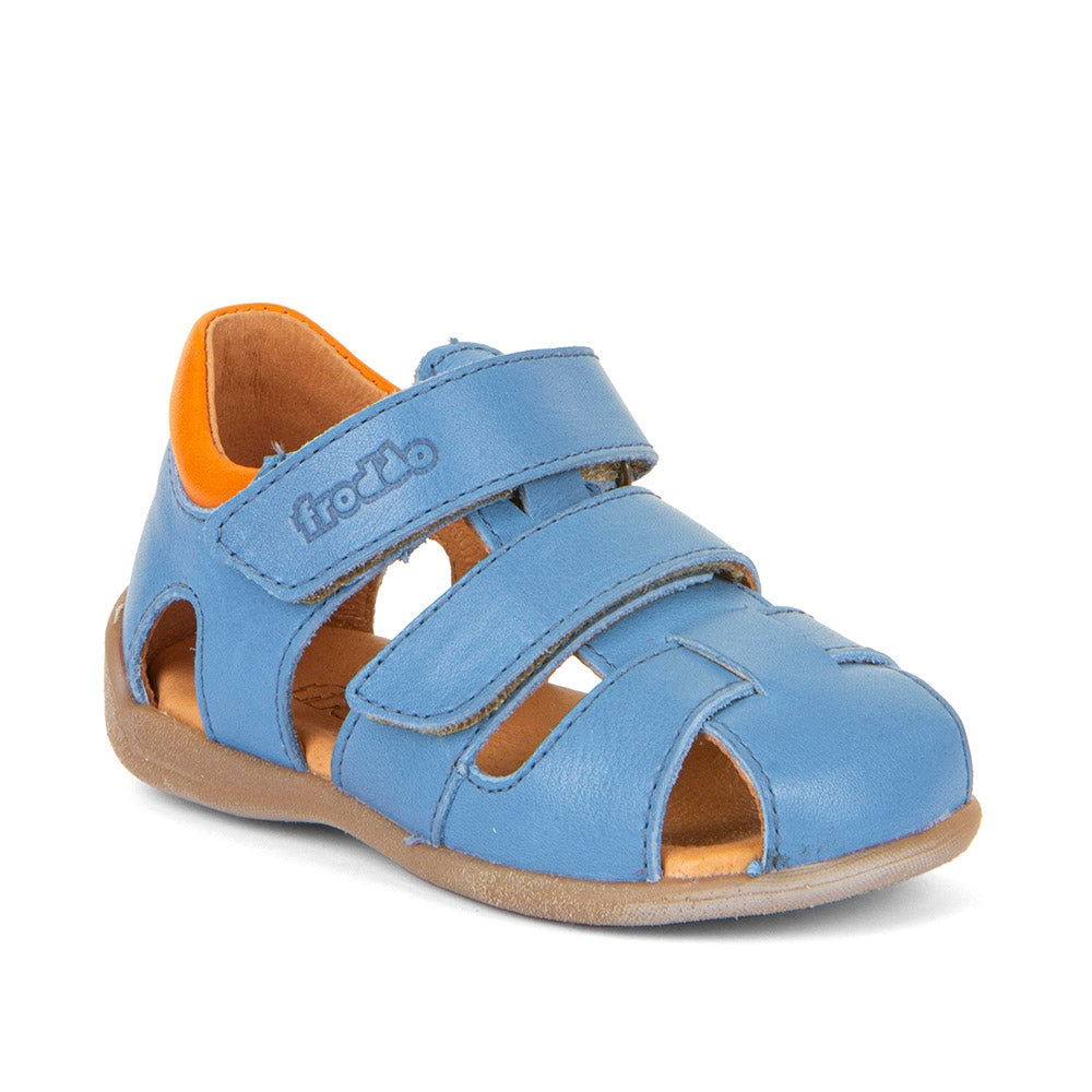 A boys leather sandal by Froddo, style Carte Double, in blue multi leather with velcro fastening. Angle view.