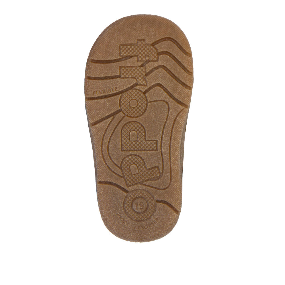 A winter boot by Froddo, style Paix Up with sheepskin fur lining with toe bumper. View of sole with Froddo logo