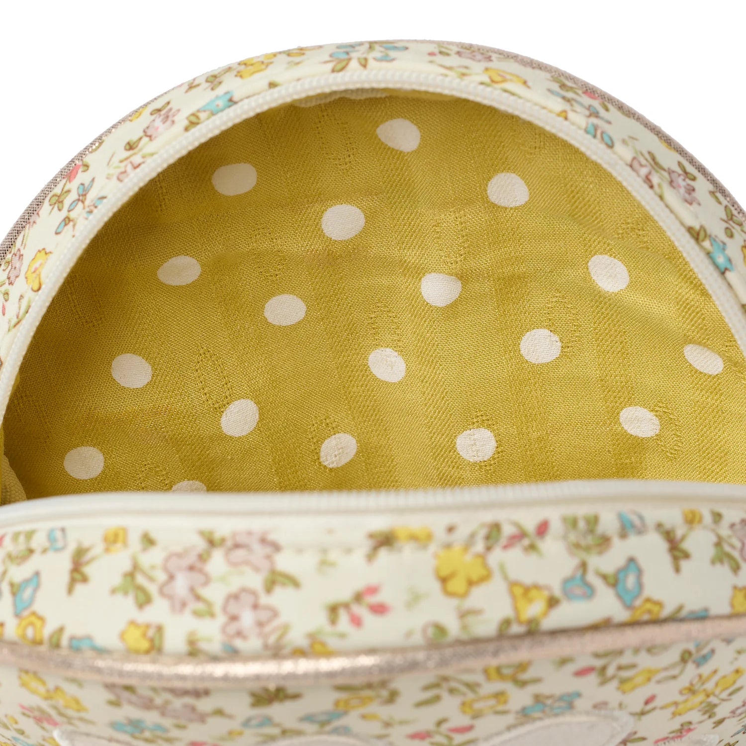 Close up of floral bag by Rockahula with yellow and white spotty fabric inside 