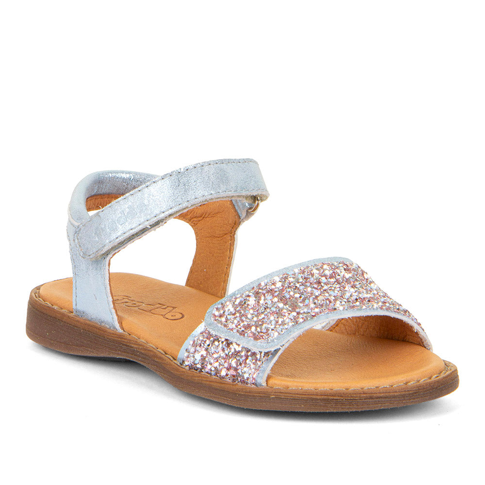  A girls open toe sandal by Froddo,style Lore Sparkle G3150249-10 in silver leather with Glitter velcro strap and velcro ankle fastening. Angle view.