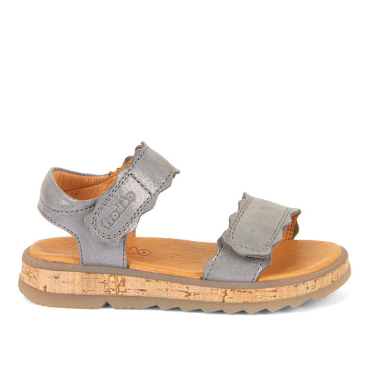 A girls open toe sandal by Froddo, style Alana G3150253-7, in silver leather set on cork effect sole unit with velcro fastening. Right side view.
