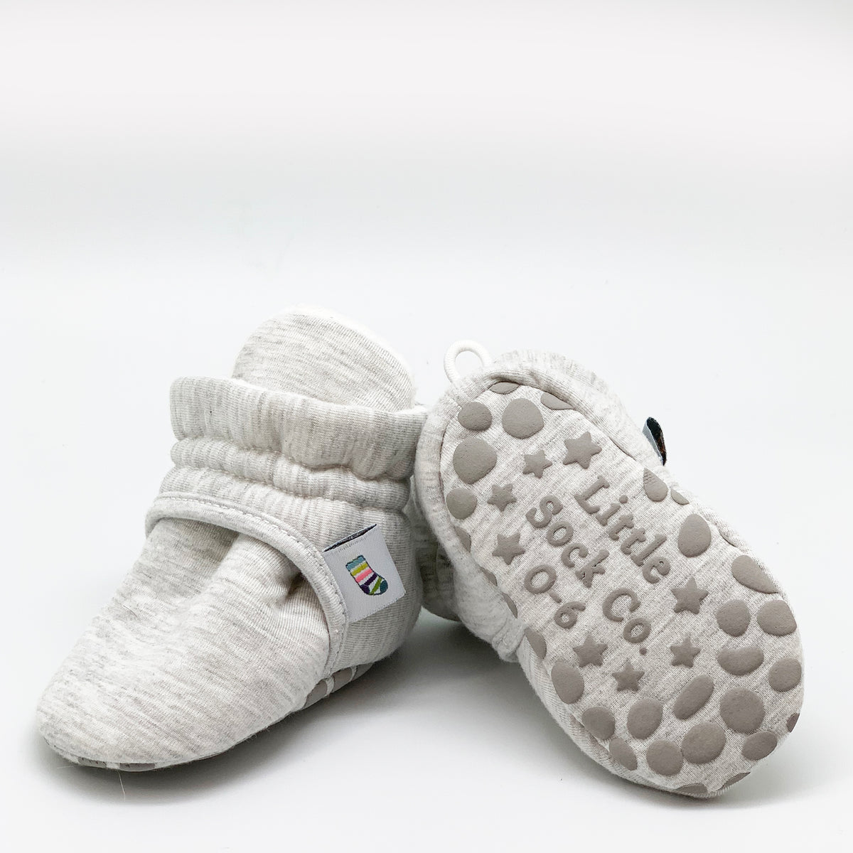 Grey bootie non slip slipper for babies. Pair view.