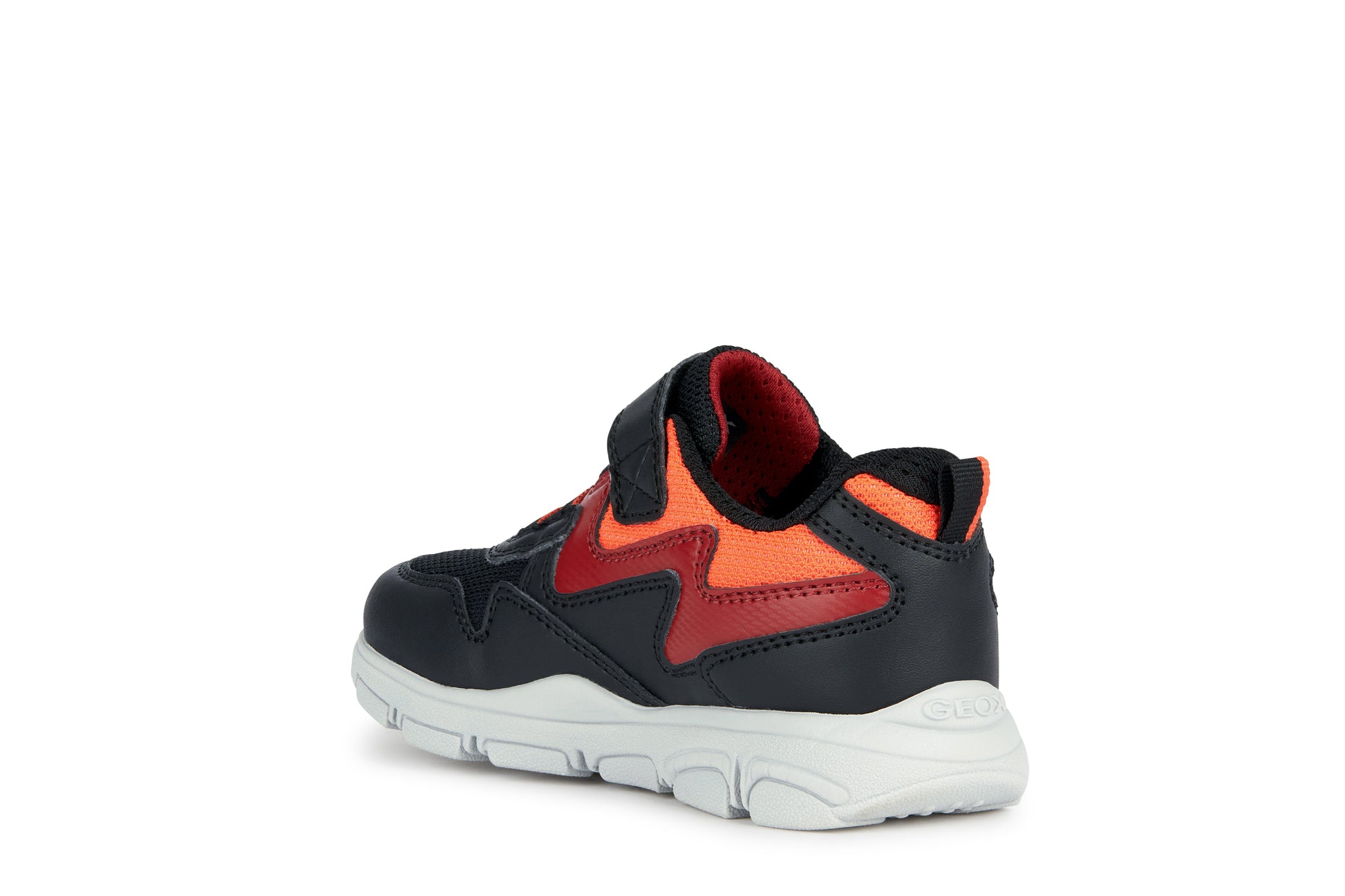A boys trainer by Geox, style New Torque, in black, red and orange with a velcro strap and bungee laces. Rear inner side angled view.