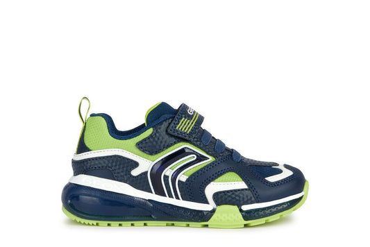 A boys casual light up trainer by Geox, style J BayonyC J36FEE, in navy and lime synthetic material and single velcro fastening. Right side view.