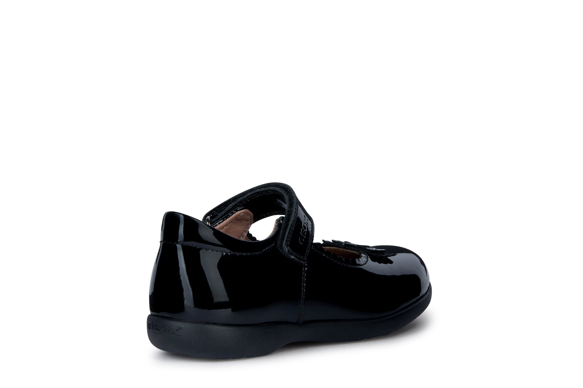 A girls school shoe by Geox, style Naimara in black patent with a velcro strap. Outer rear side angled view