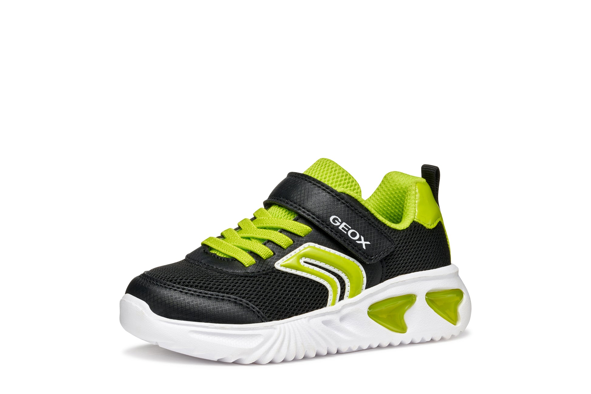 A boys trainer by Geox, style Assister, in black/lime with velcro strap and green laces. Left side view.