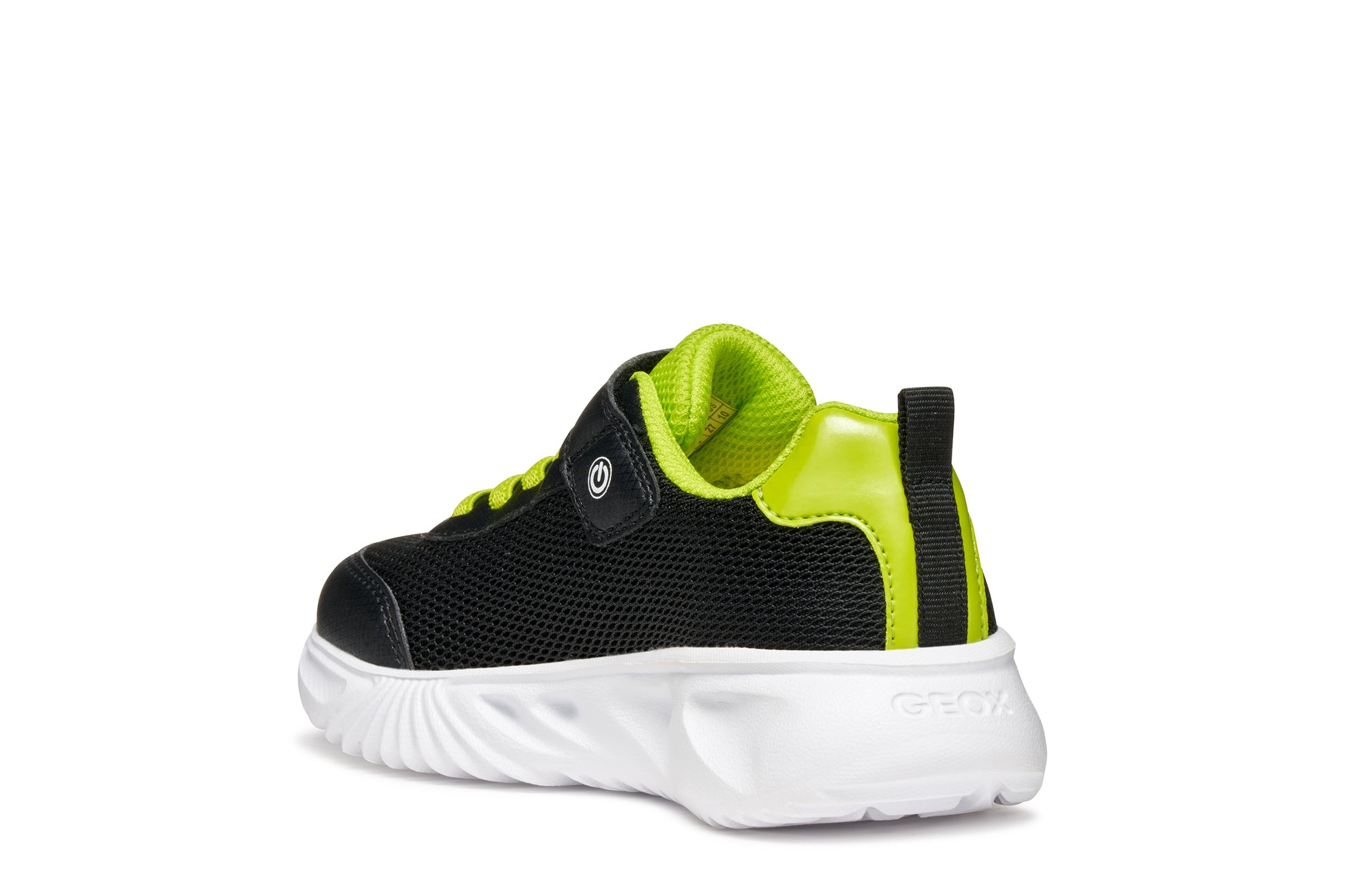 A boys trainer by Geox, style Assister, in black/lime with velcro strap and green laces. Angled left side view.