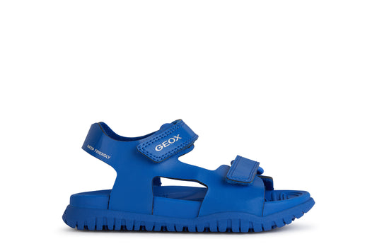 A unisex open toe synthetic water friendly sandal by Geox. Style Fusbetto in royal blue with two velcro fastenings. Right side view.