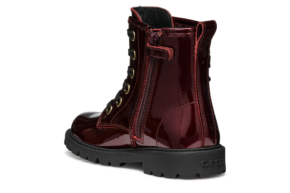 Geox girls patent boot in the style Shaylax in the colour burgundy with black laces, butterfly details and a black sole. Angled back view of right boot. 