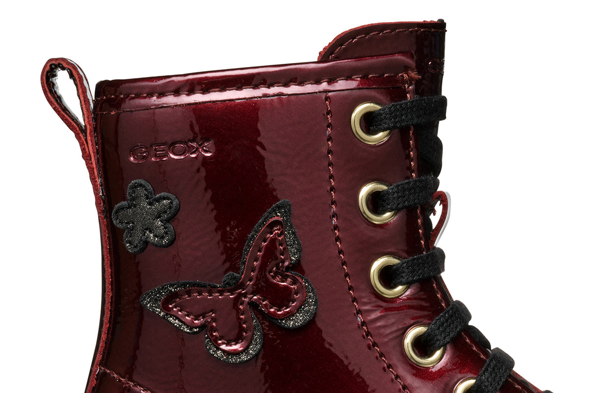 Geox girls patent boot in the style Shaylax in the colour burgundy with black laces, butterfly details and a black sole. Right side view