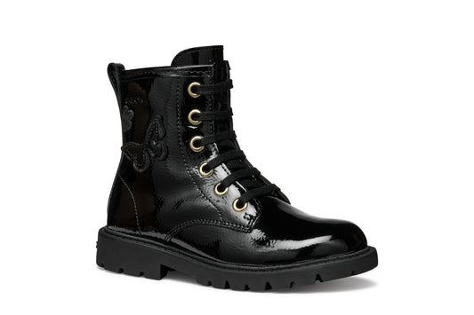 A girls combat style boot by Geox, style J56EXA Shaylax, in black patent  leather with butterfly detail. Lace and zip fastening. Right side view.