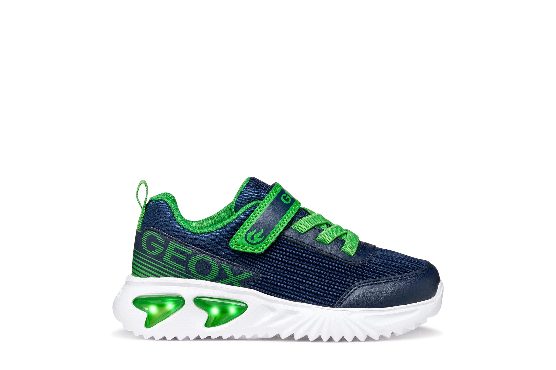A boys trainer by Geox style Assister in navy/green with velcro strap, elastic laces, large geox logo on the side and lights in white sole. Right side view