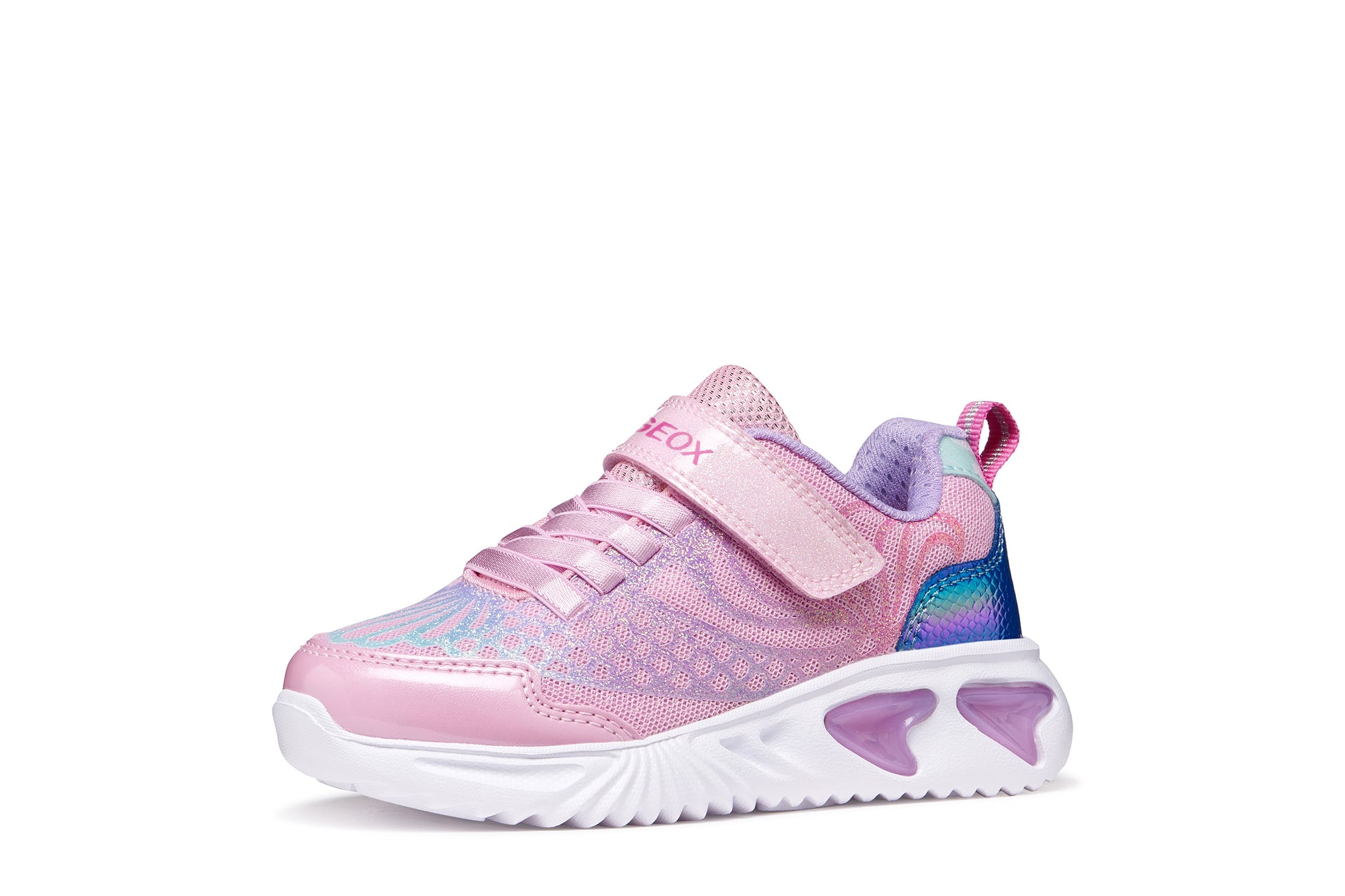 A girls trainer by Geox, style Assister in pink/lilac with one velcro strap and elastic laces, mermaid detail on heel and lights in sole. Angled right side view