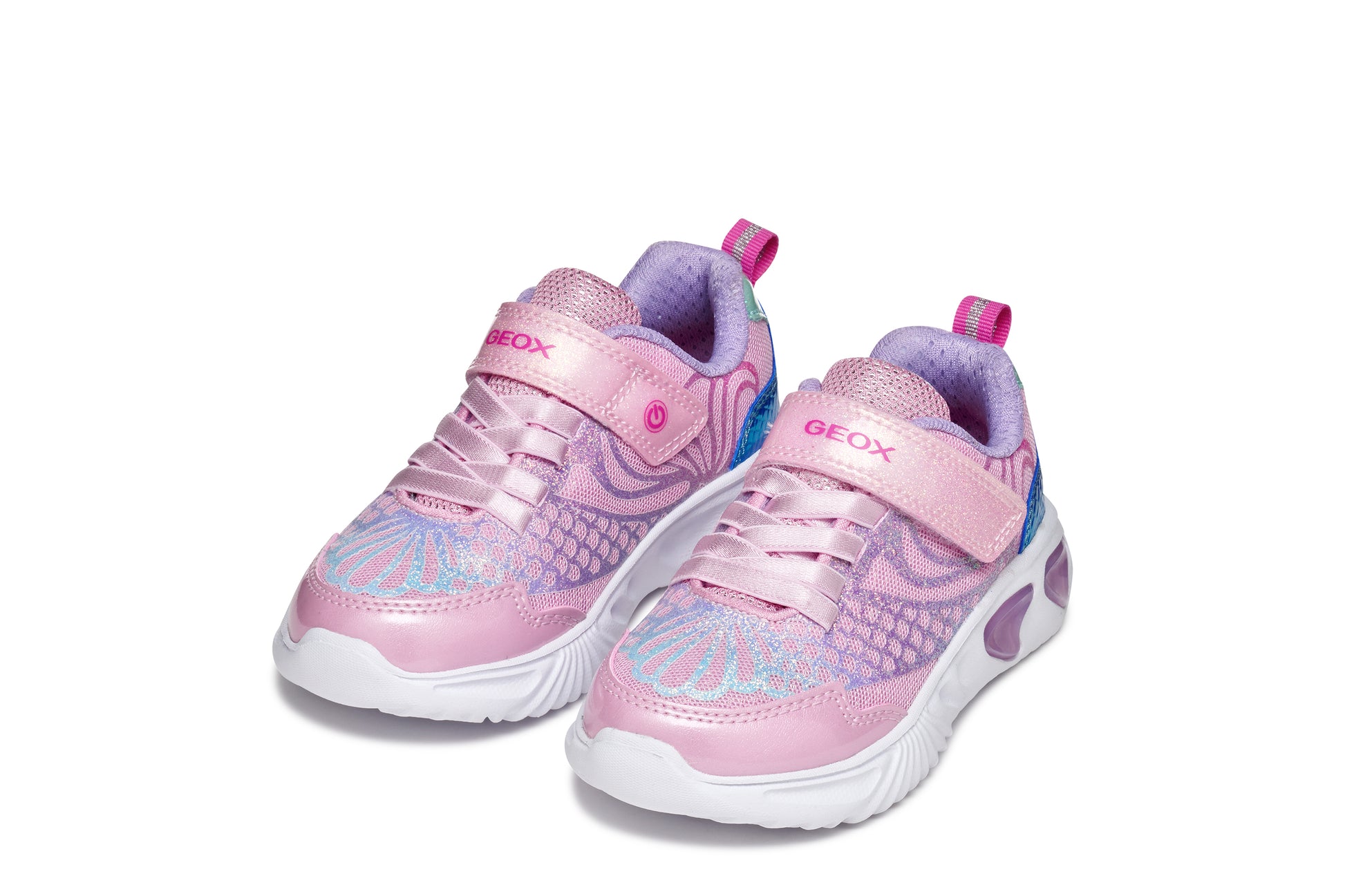 A girls trainer by Geox, style Assister in pink/lilac with one velcro strap and elastic laces, mermaid detail on heel and lights in sole. Front view of pair side by side