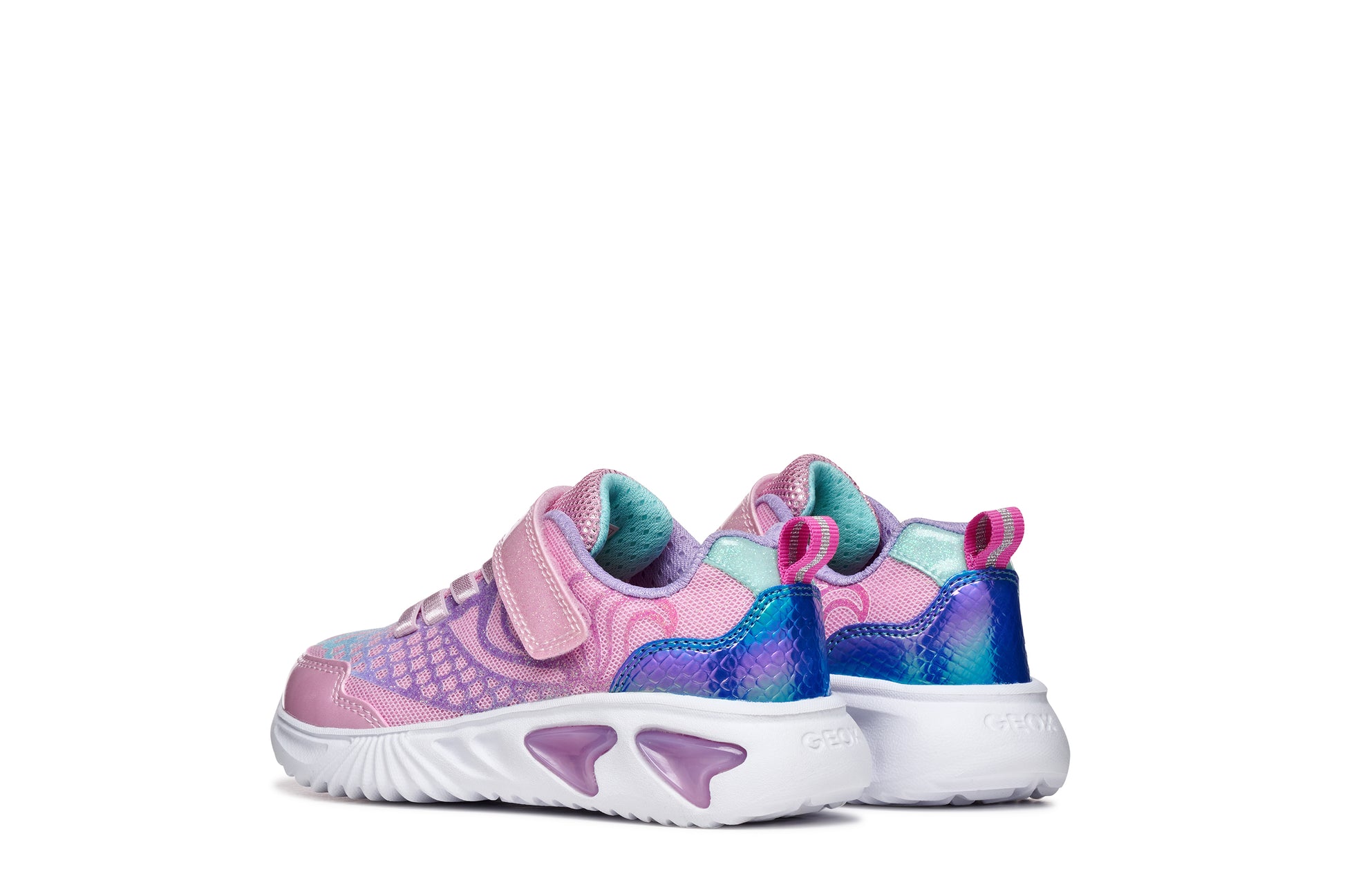 A girls trainer by Geox, style Assister in pink/lilac with one velcro strap and elastic laces, mermaid detail on heel and lights in sole. Back view of pair side by side
