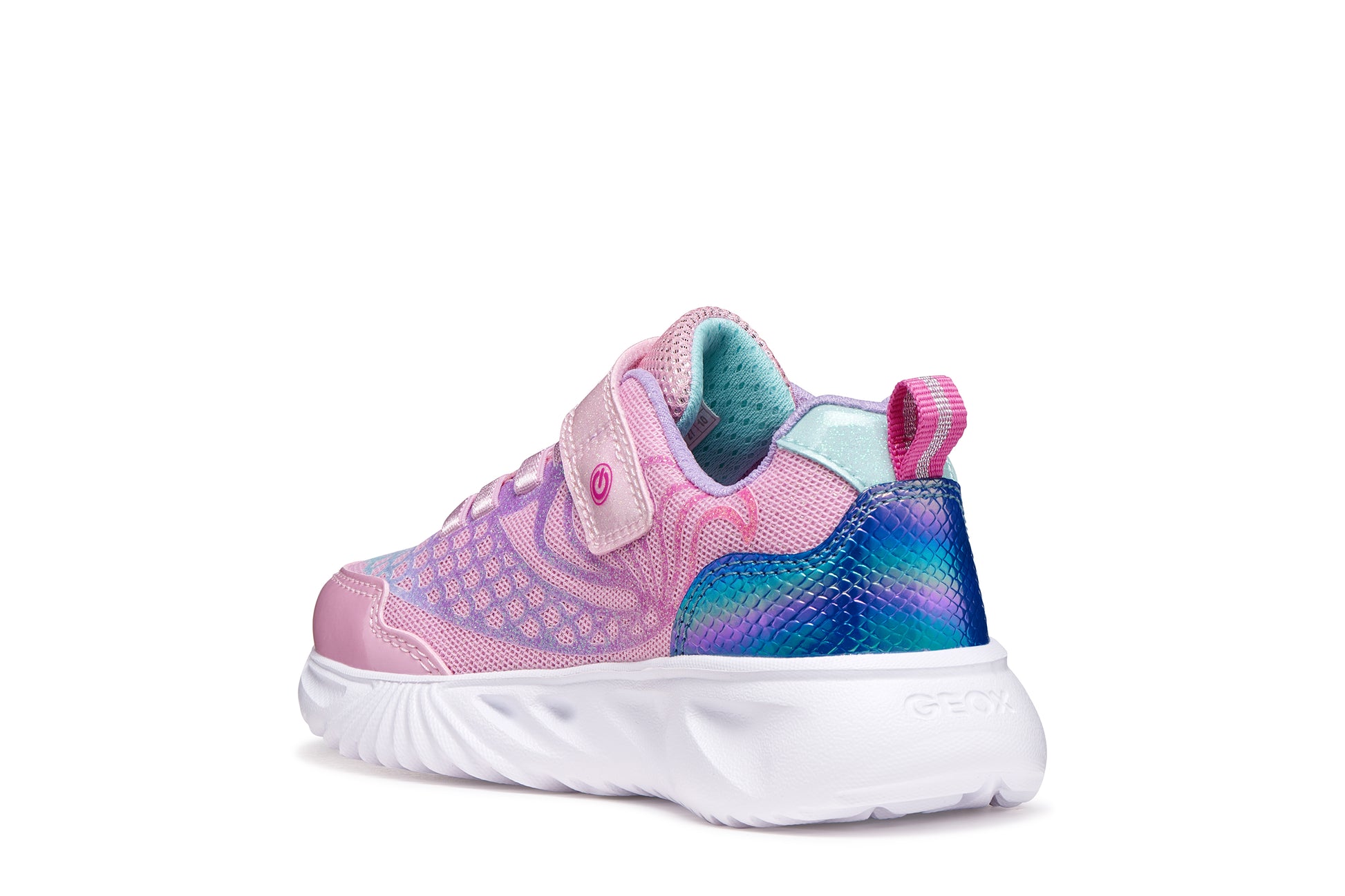 A girls trainer by Geox, style Assister in pink/lilac with one velcro strap and elastic laces, mermaid detail on heel and lights in sole. Left back view