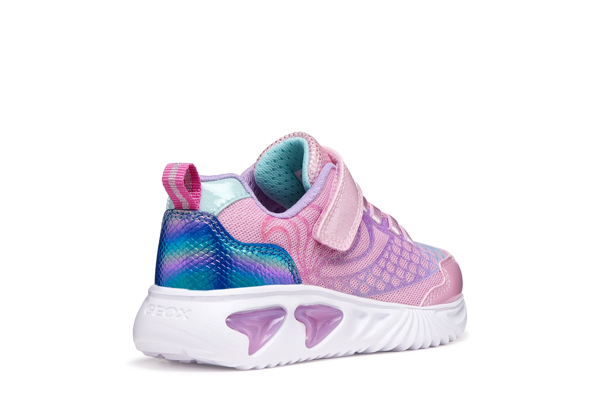 A girls trainer by Geox, style Assister in pink/lilac with one velcro strap and elastic laces, mermaid detail on heel and lights in sole. Right back view