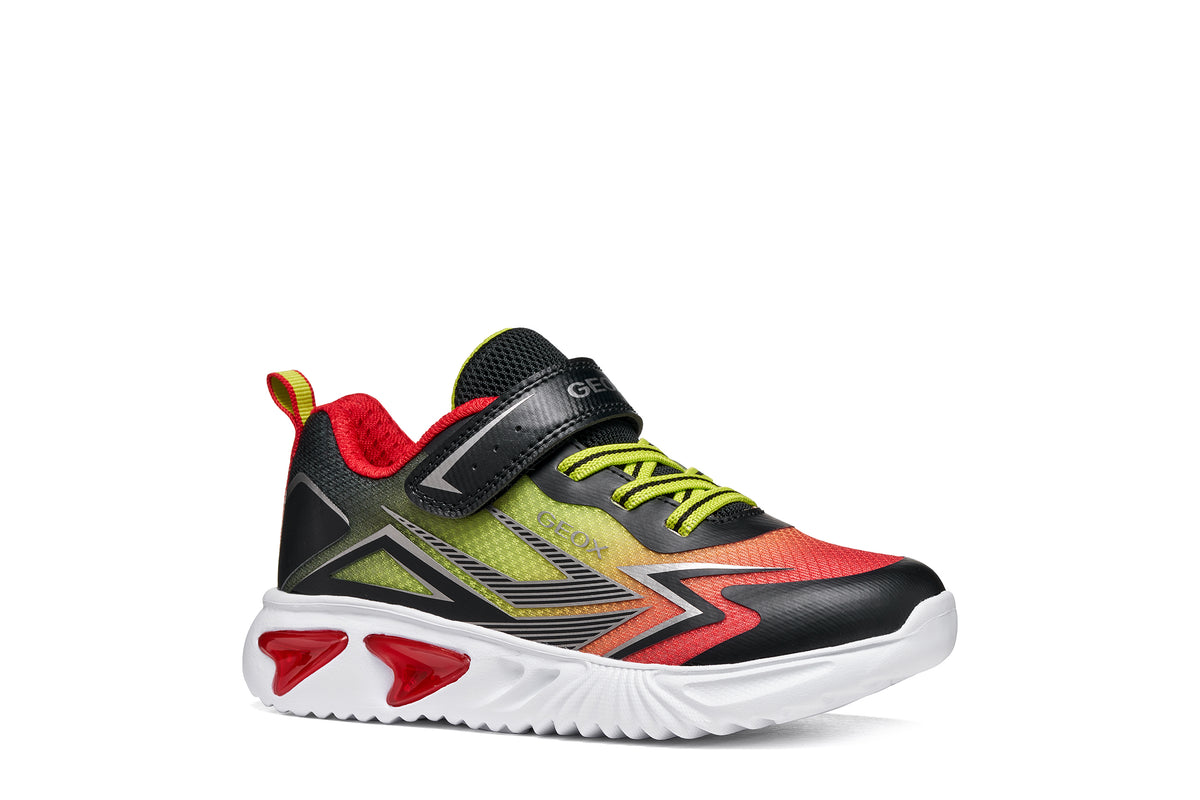 Geox boy's trainer in the style Assister, in red, yellow and black with a Velcro strap, lights and a white sole. Right side view.
