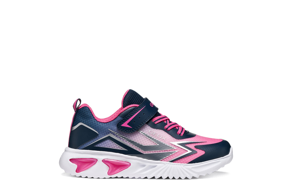 Geox girls trainer in the style Assister in navy, pink and white with a Velcro strap, lights and a white sole. Right side view.