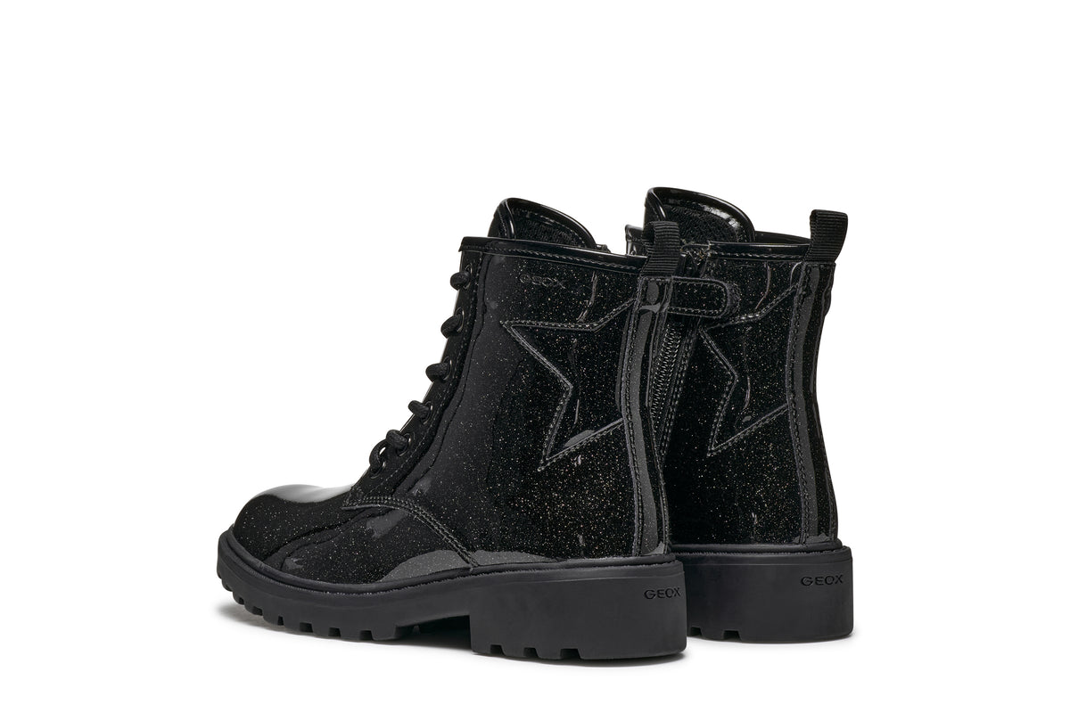 Geox girl's patent ankle boot in the style Casey Girl, with laces, side zip fastening, glitter details all over and chunky black sole. Angled back view.