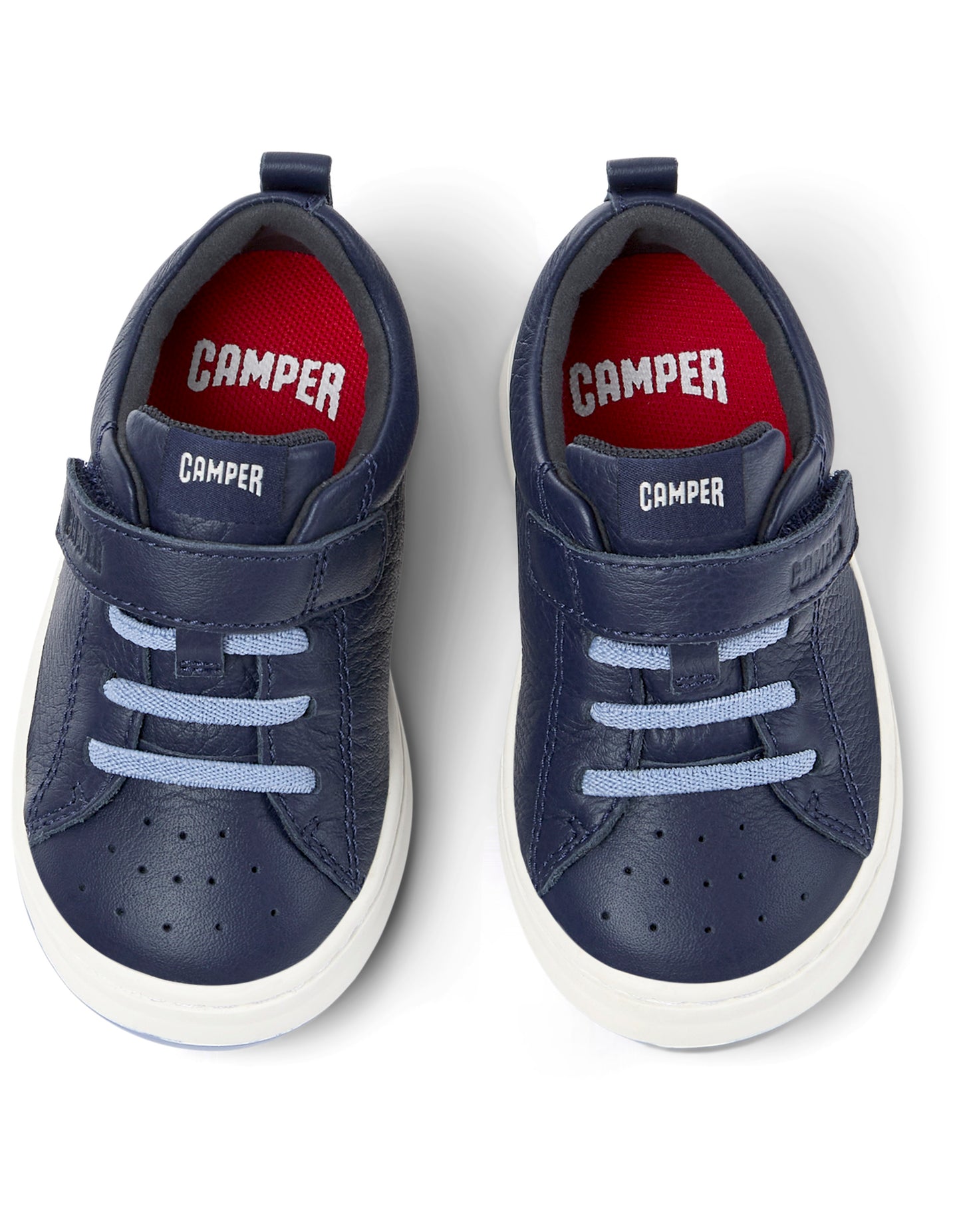 A boys shoe by Camper, style Runner FW, in navy with velcro strap and light blue elastic laces. Above view of a pair.