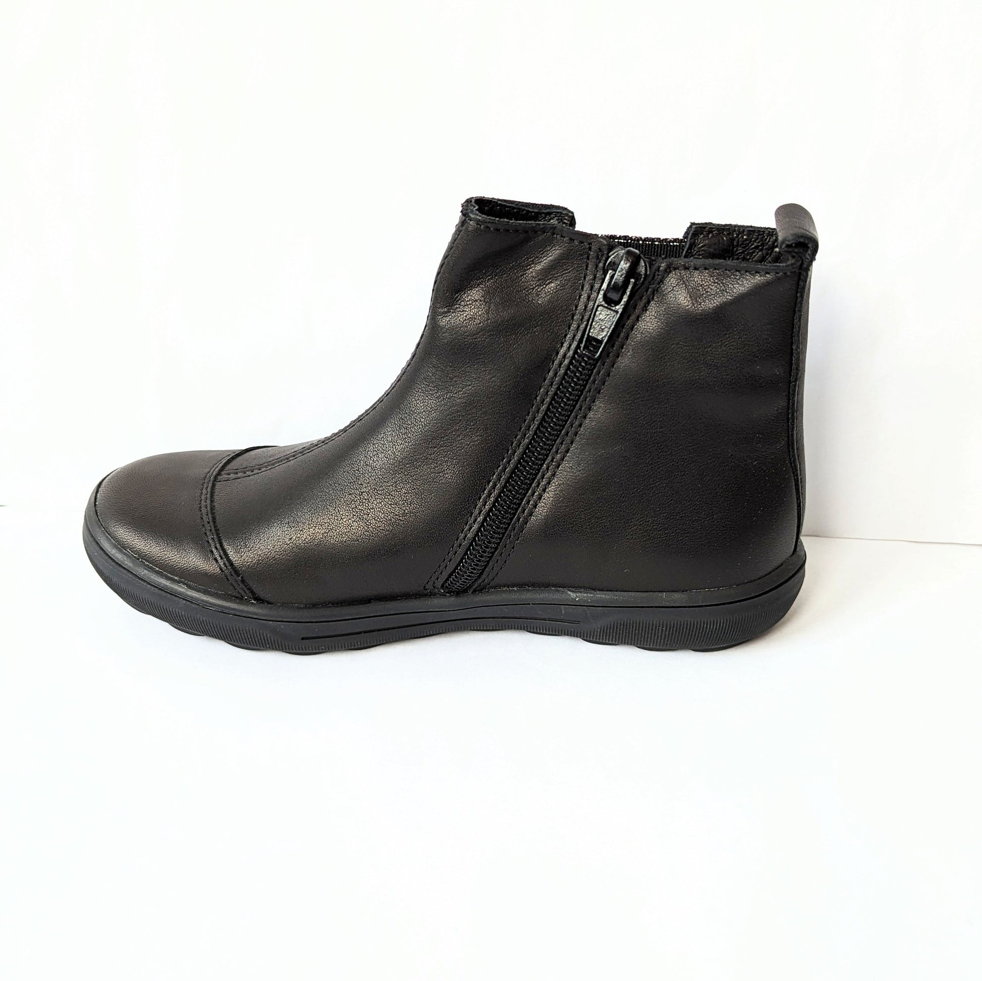 A girls ankle boot by Bopy, style Sonate, in black leather/black gold print nubuck with elastic gusset and zip fastening.   Left side view.