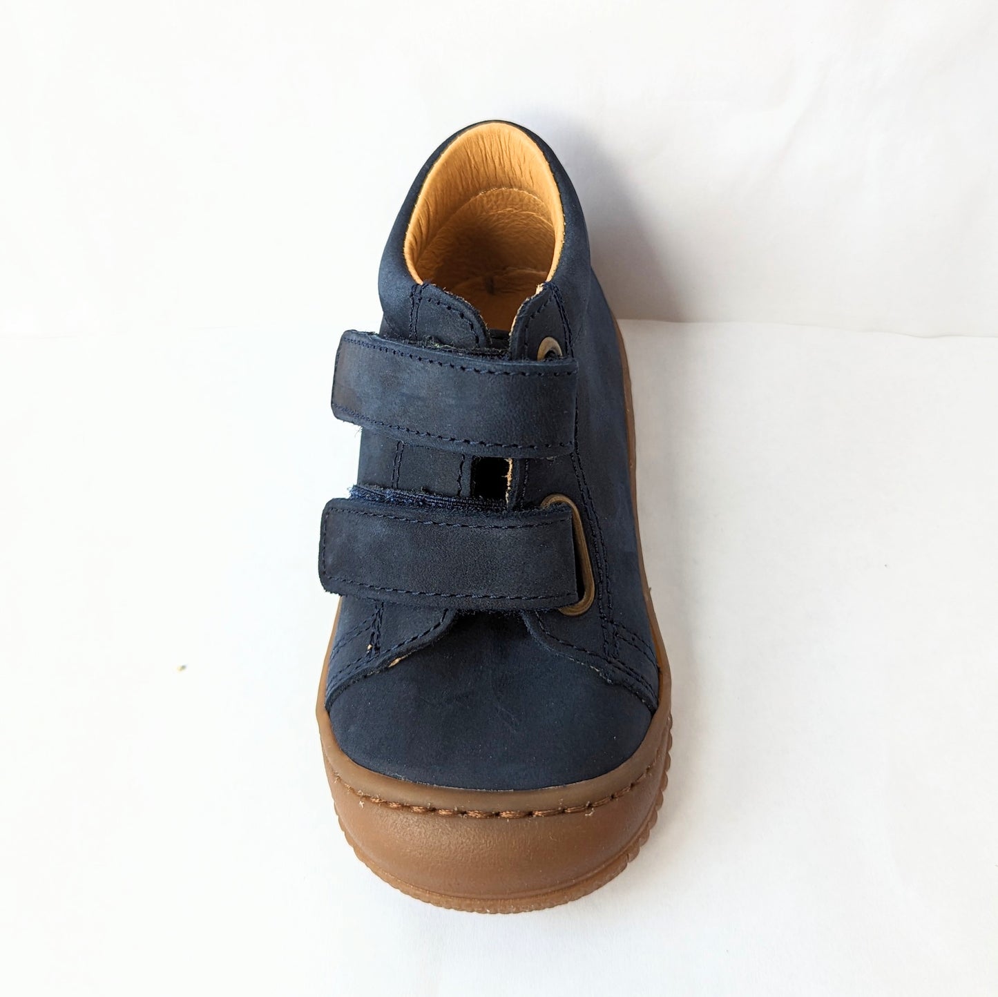 A boys ankle boot by Bopy, style Jameco, in navy nubuck with toe bumper and double velcro fastening. Right side view.Front view.