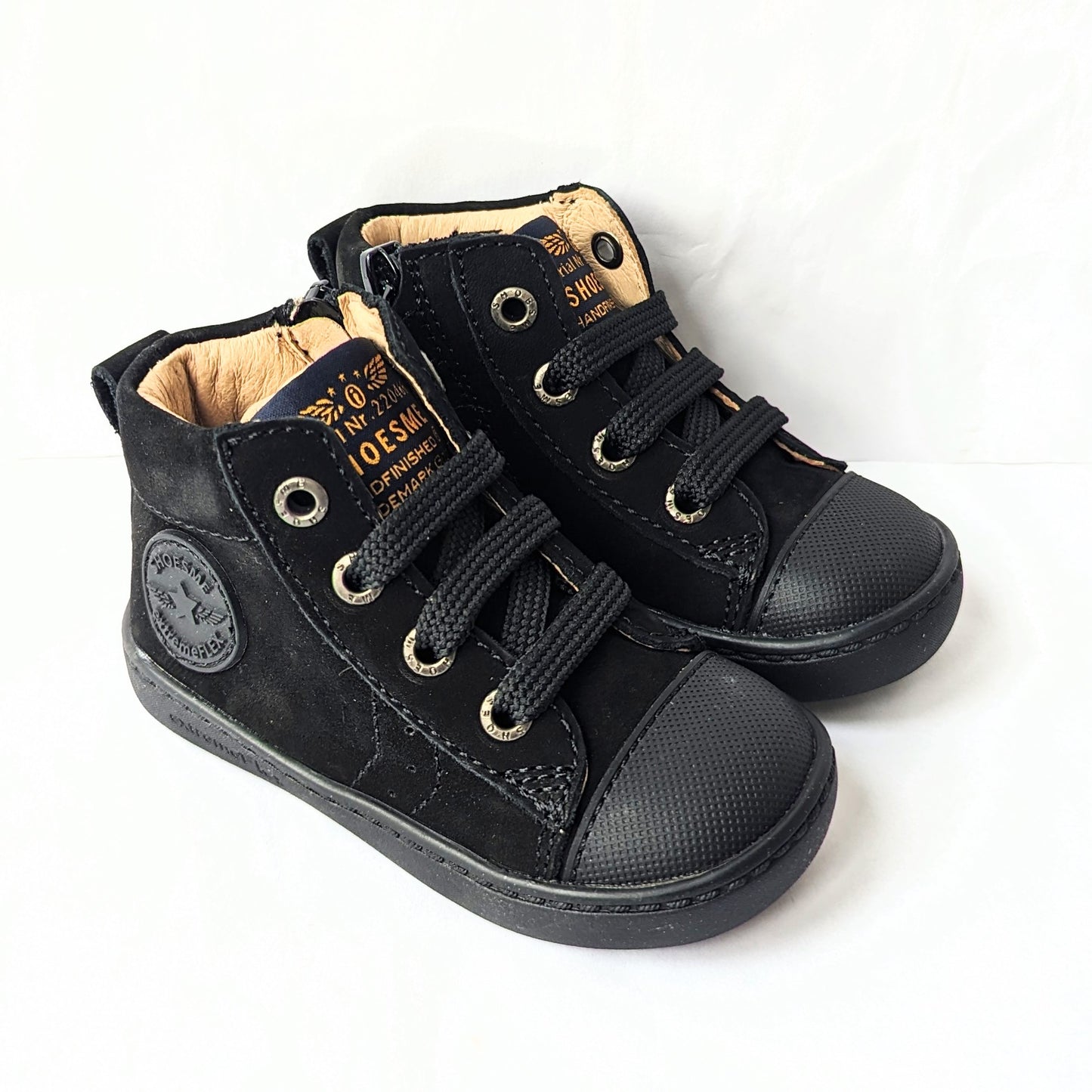 A pair of unisex hi-top boots by Shoesme, style FL23W002-A in black leather nubuck with lace and zip fastening. Angled view.