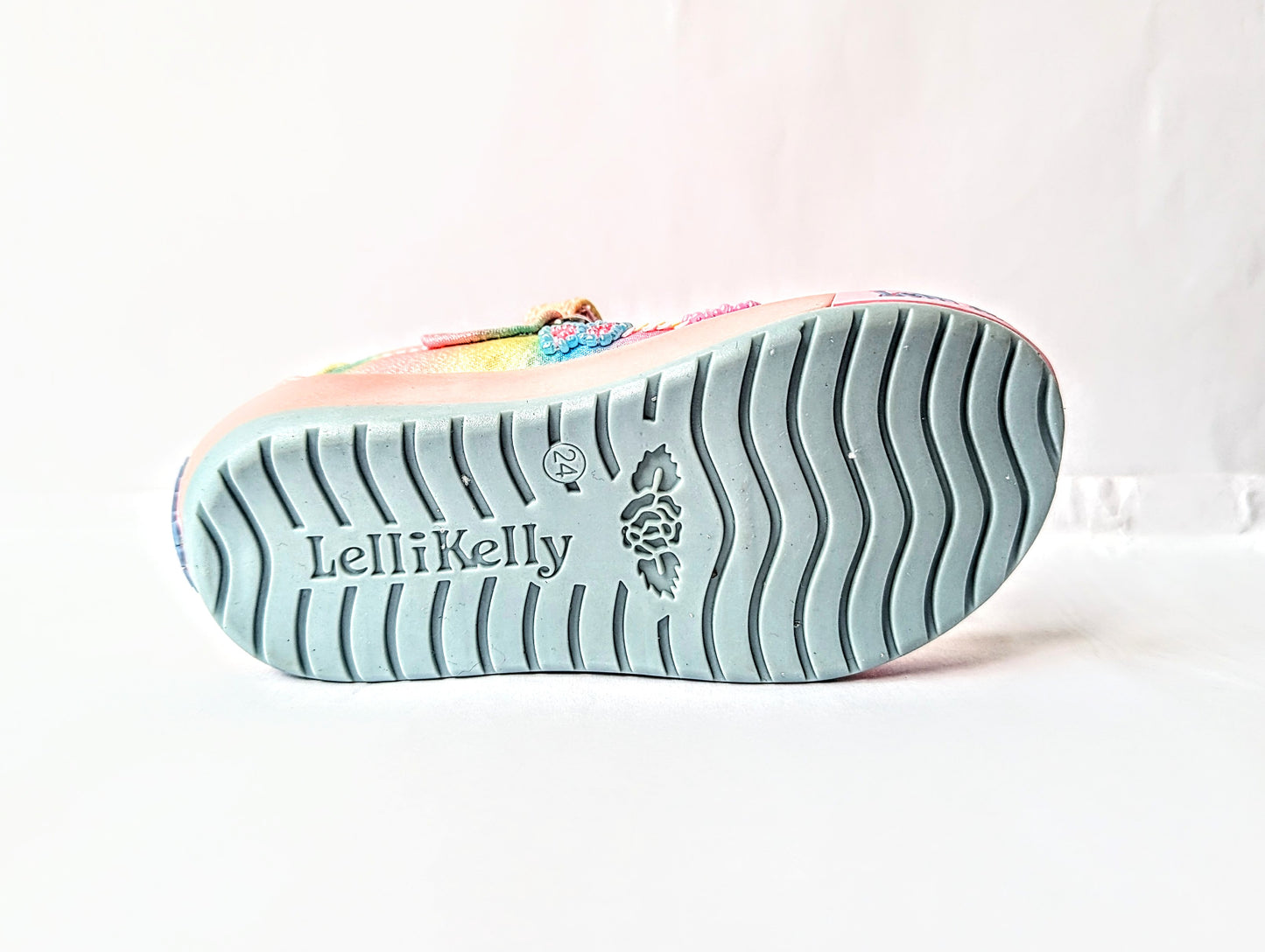 A girls Mary Jane shoe by Lelli Kelly, style LKED3463 Myla, in multi coloured canvas with sequin and bead embellishments and velcro fastening. View of sole showing Lelli Kelly branding.
